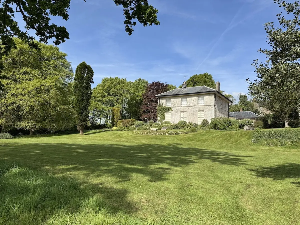 Well-maintained Cornish garden with clipped lawn and established planting