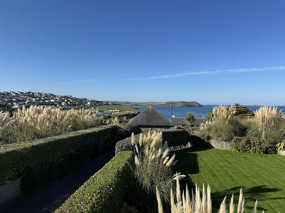 Freshly cut hedges and a neat lawn in a coastal Cornish garden