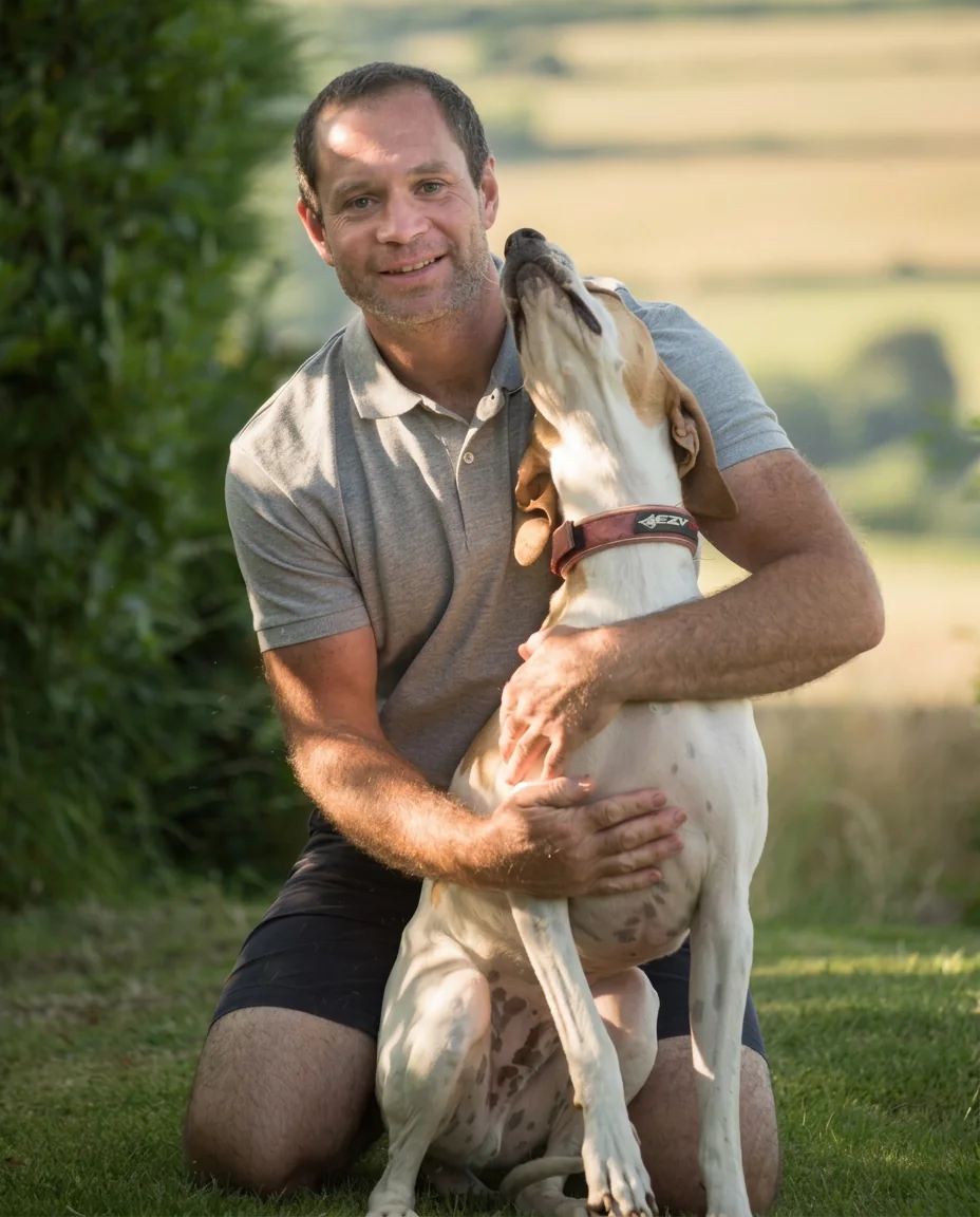 James from Cornish Lawns with his dog on a freshly mown lawn